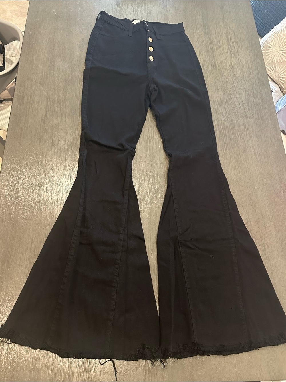 Vibrant Black High-Waist Flare Jeans with Button Front